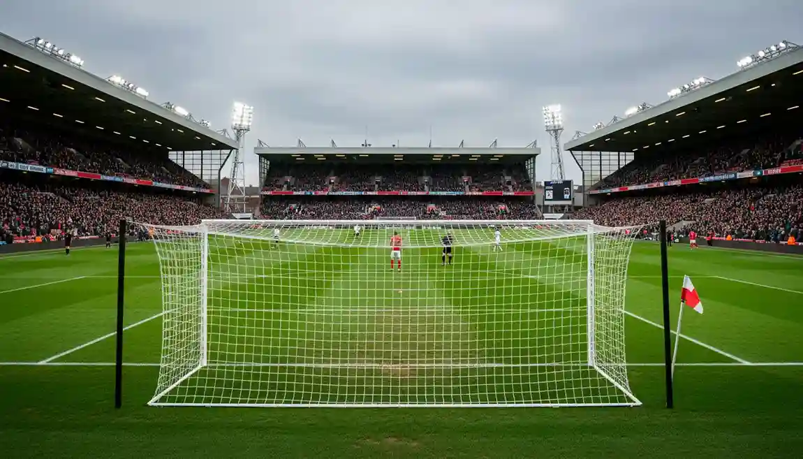 Stade de Premier League avec pelouse impeccable et projecteurs allumés en soirée
